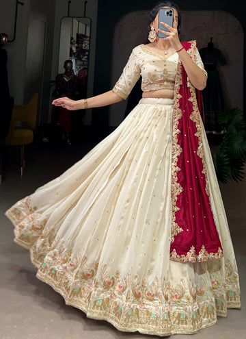 Classic cream Lehenga choli with elegant zari and sequin thread embroidery work.